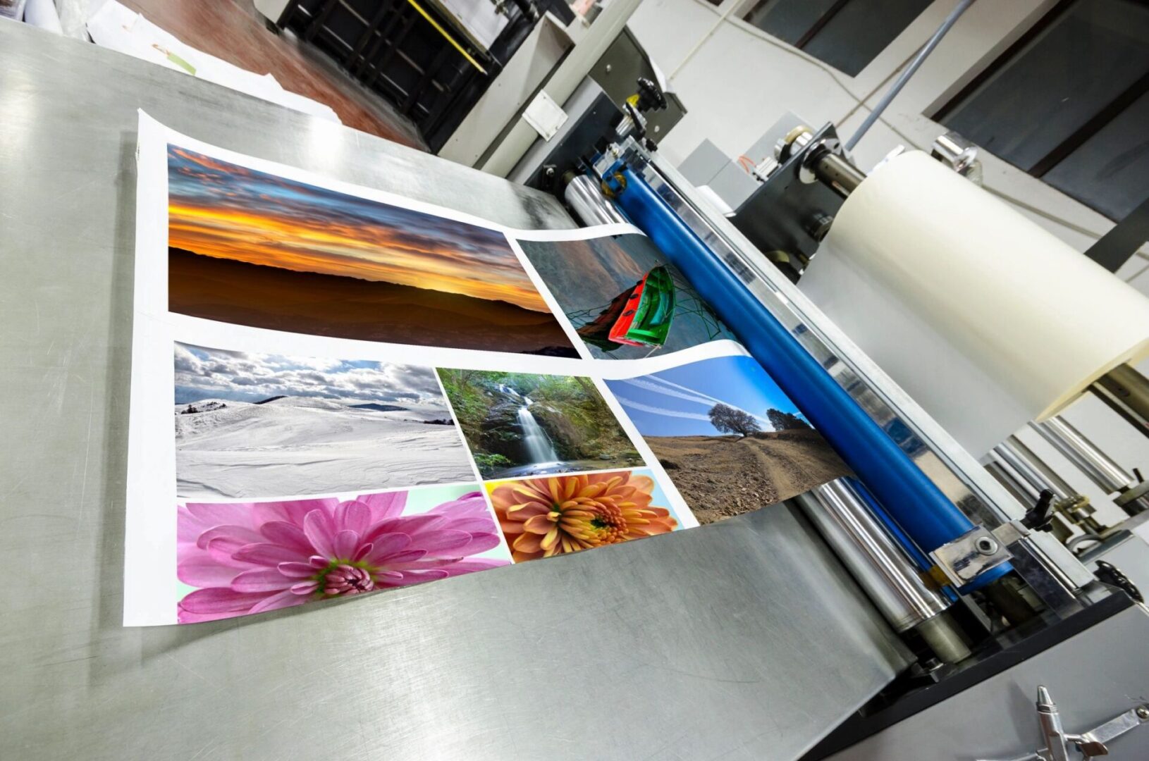A close up of several pictures on the printing press